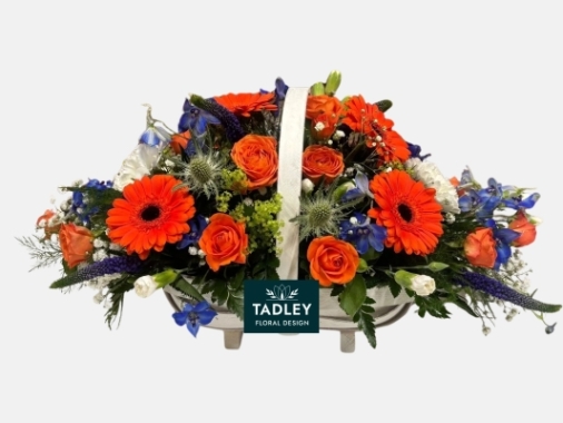 White Basket Of Flowers With Orange & Blue Flowers